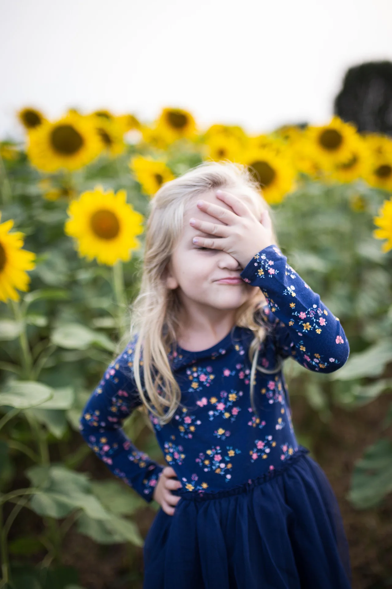 Little girl with sunflower